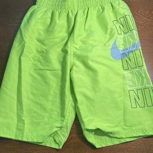 Nike youth large swim trunks, neon green and black.